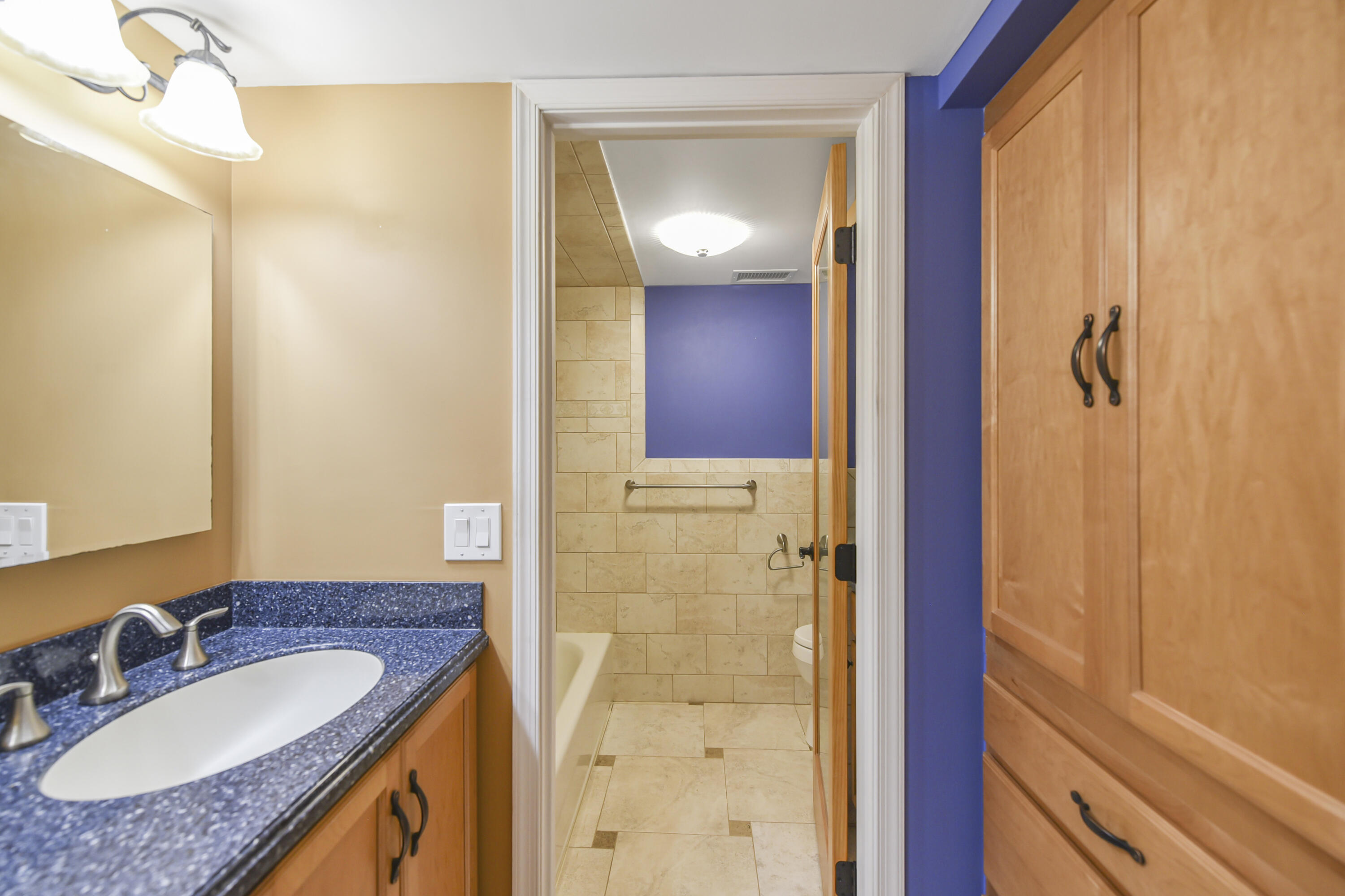 102 Woodland Road Palm Springs, FL 33461 - Photo 38 of 41 a bathroom with a granite countertop sink and a mirror
