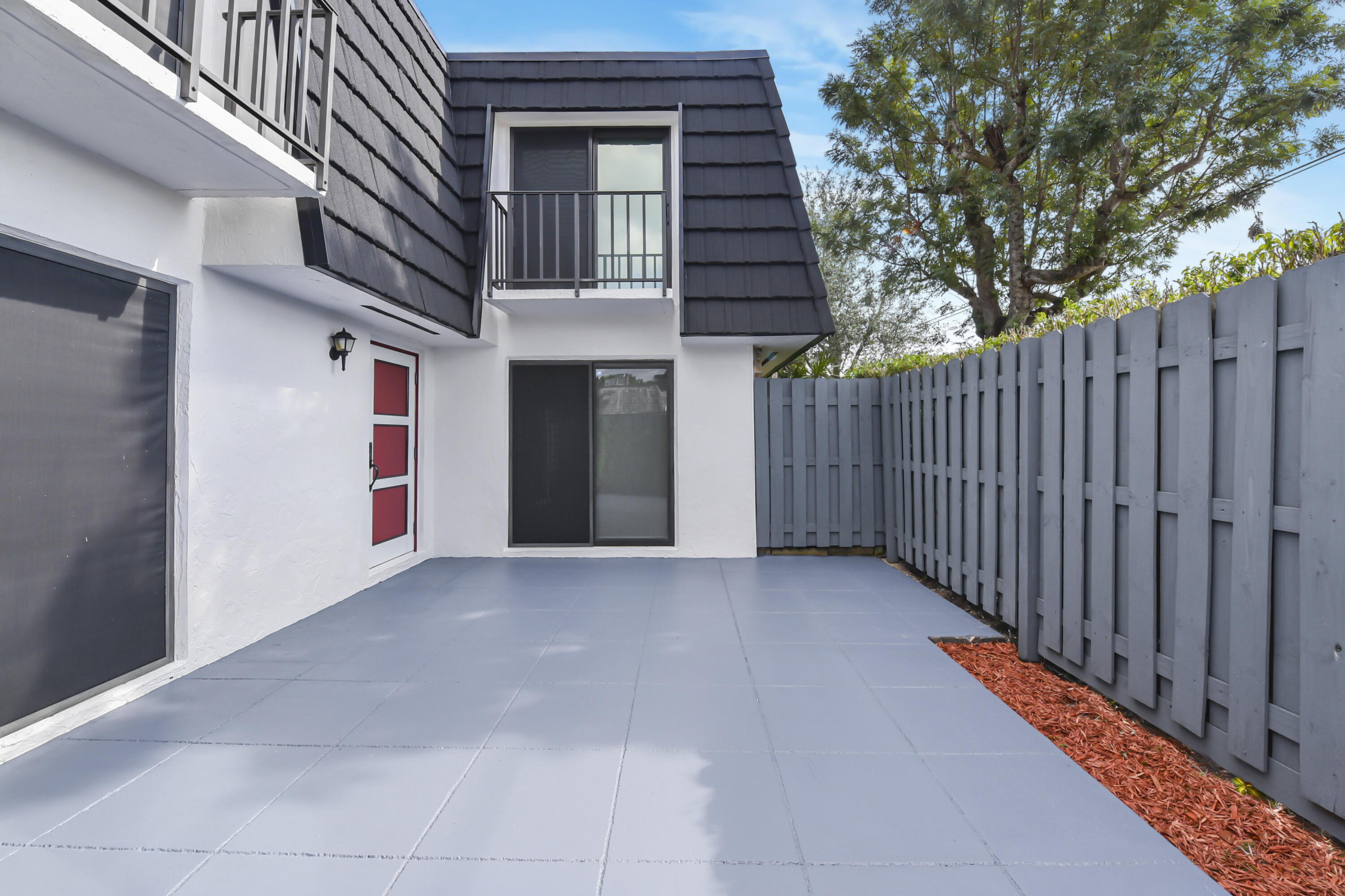 102 Woodland Road Palm Springs, FL 33461 - Photo 10 of 41 a view of a house with a garage