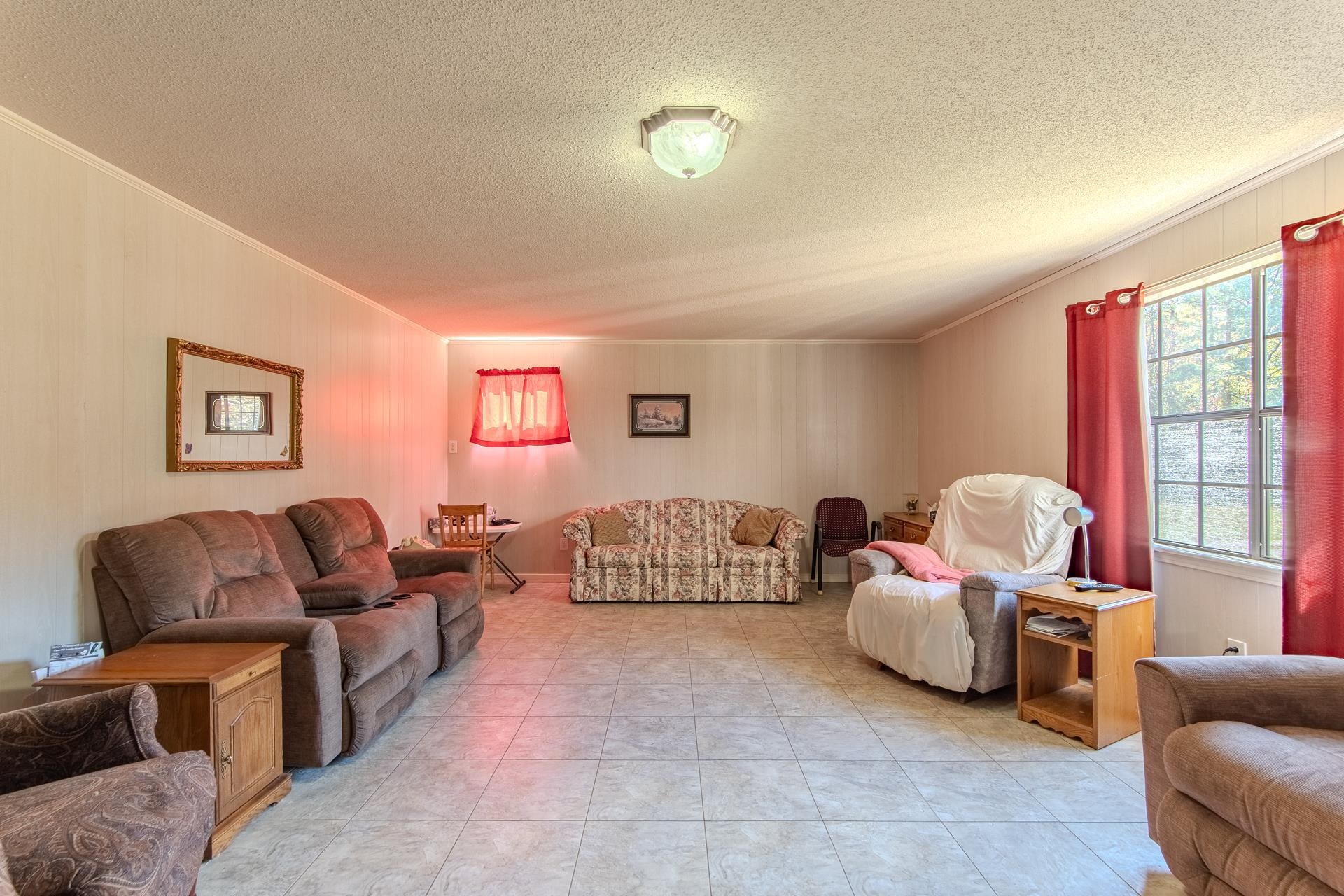 4485 Holland Creek Road Savannah, TN 38372 - Photo 12 of 39 a living room with furniture and a large window