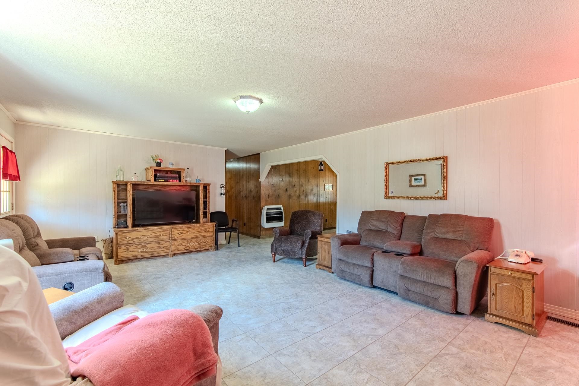 4485 Holland Creek Road Savannah, TN 38372 - Photo 14 of 39 a living room with furniture and a flat screen tv