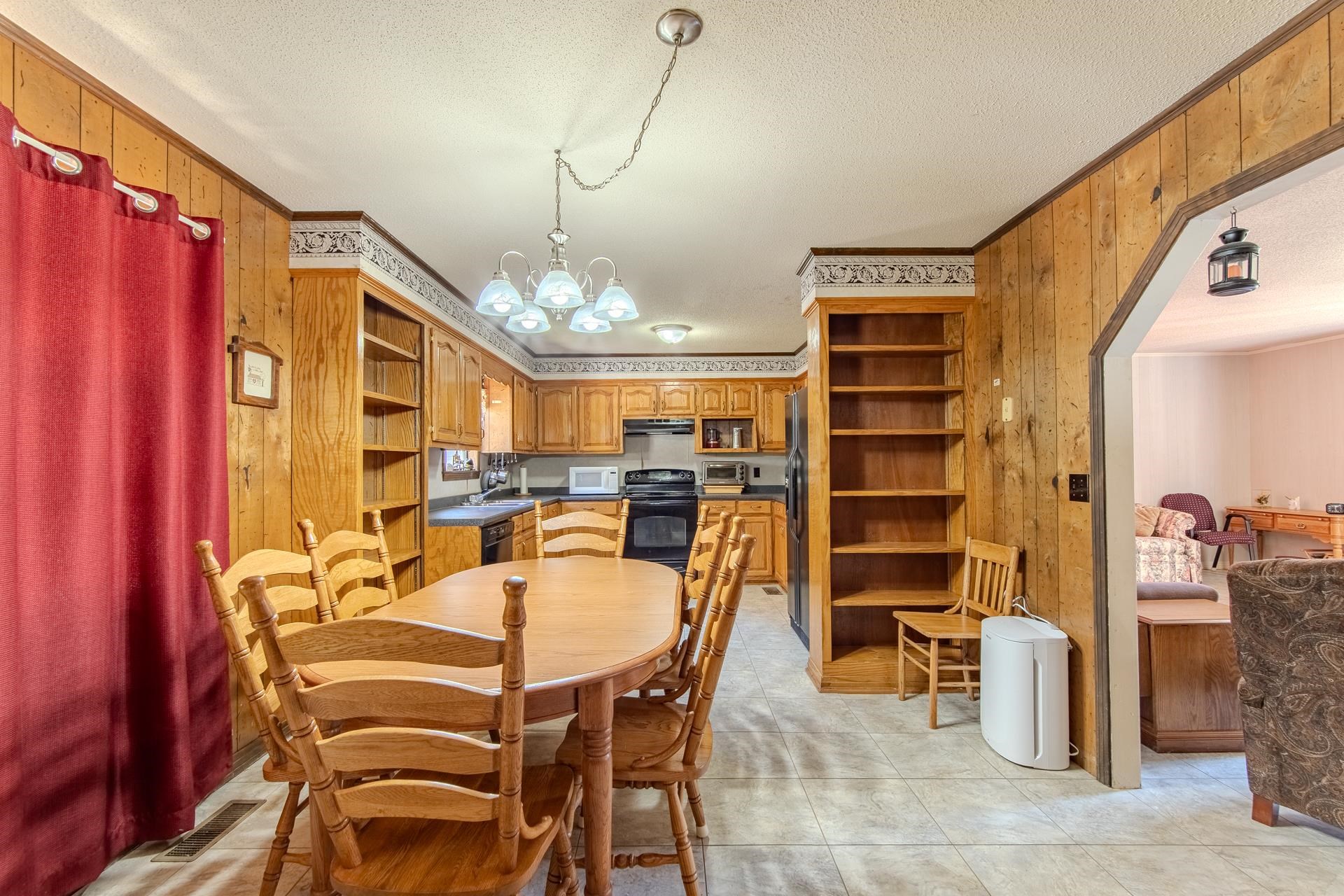 4485 Holland Creek Road Savannah, TN 38372 - Photo 17 of 39 a dining room with furniture and chandelier