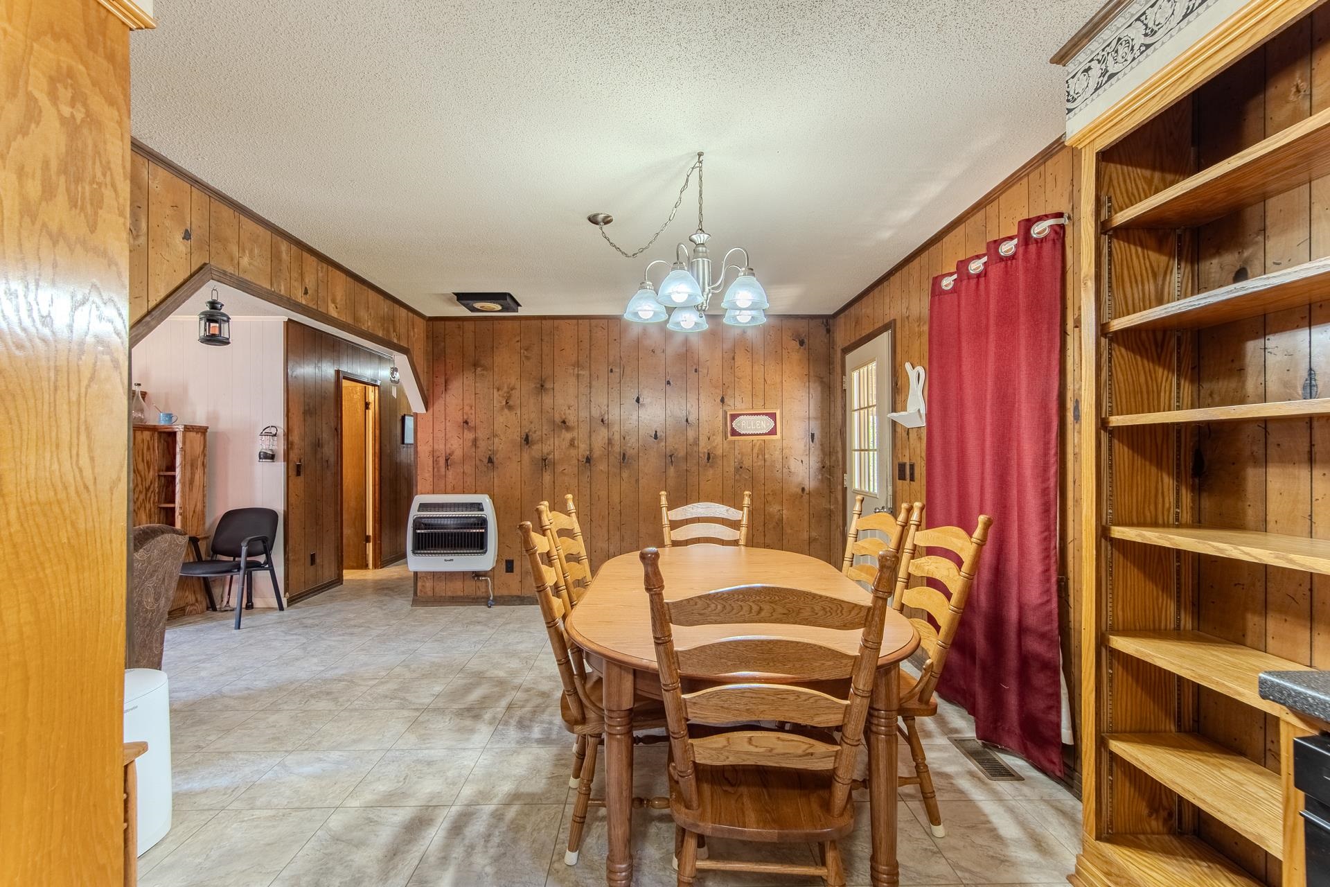4485 Holland Creek Road Savannah, TN 38372 - Photo 20 of 39 a view of a dining room with furniture and chandelier