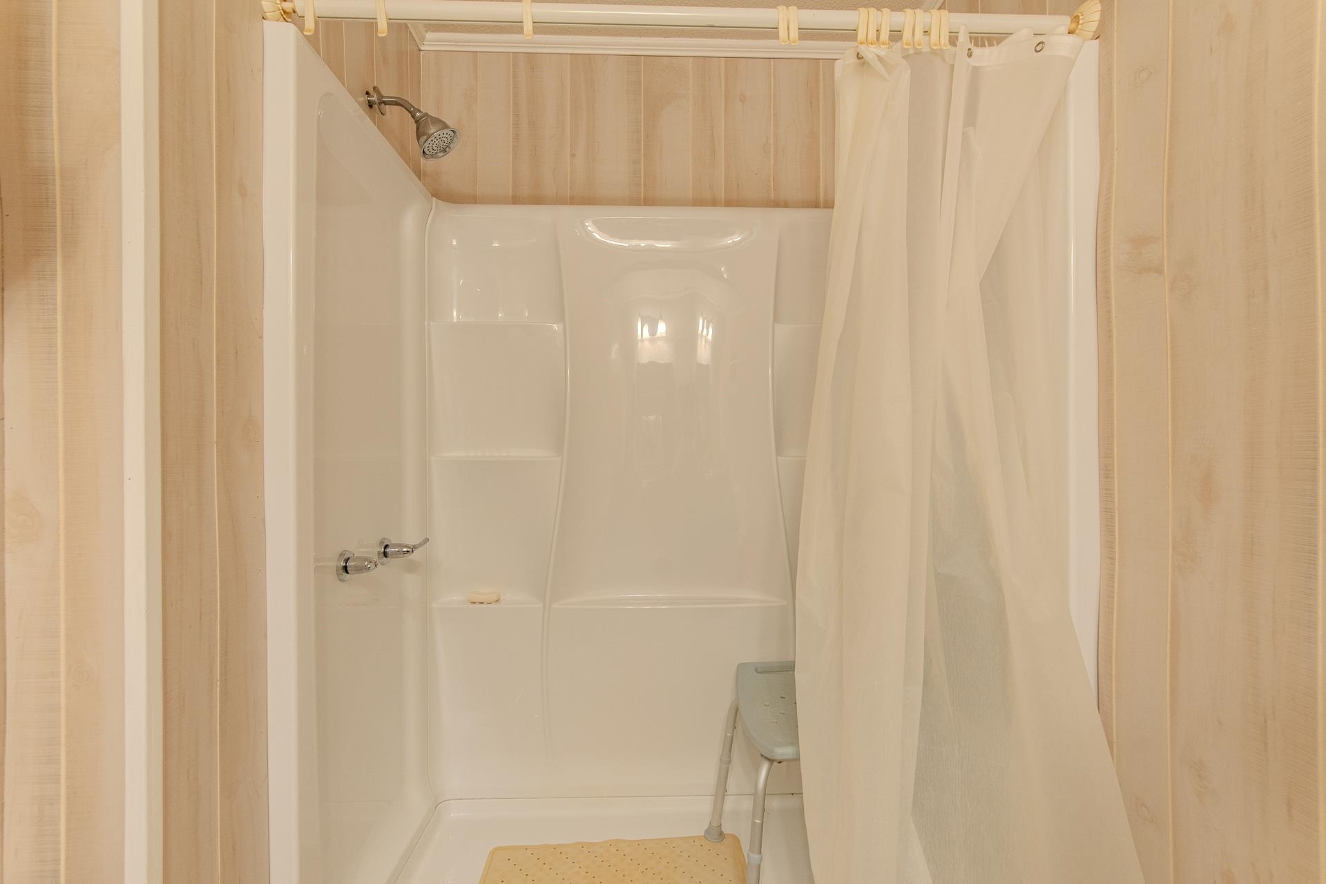 4485 Holland Creek Road Savannah, TN 38372 - Photo 23 of 39 a bathroom with a shower curtain