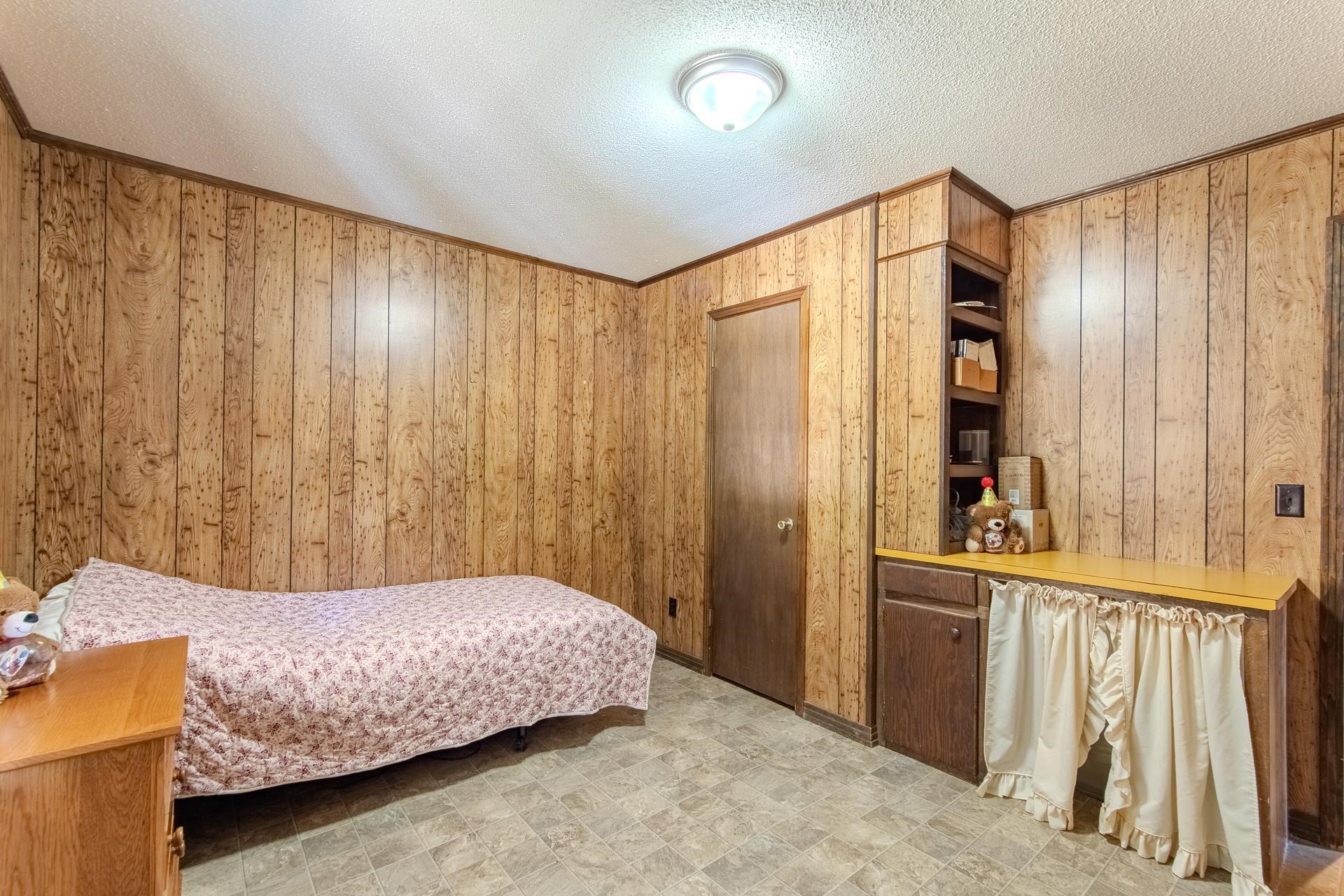 4485 Holland Creek Road Savannah, TN 38372 - Photo 24 of 39 a bedroom with a bed and a window
