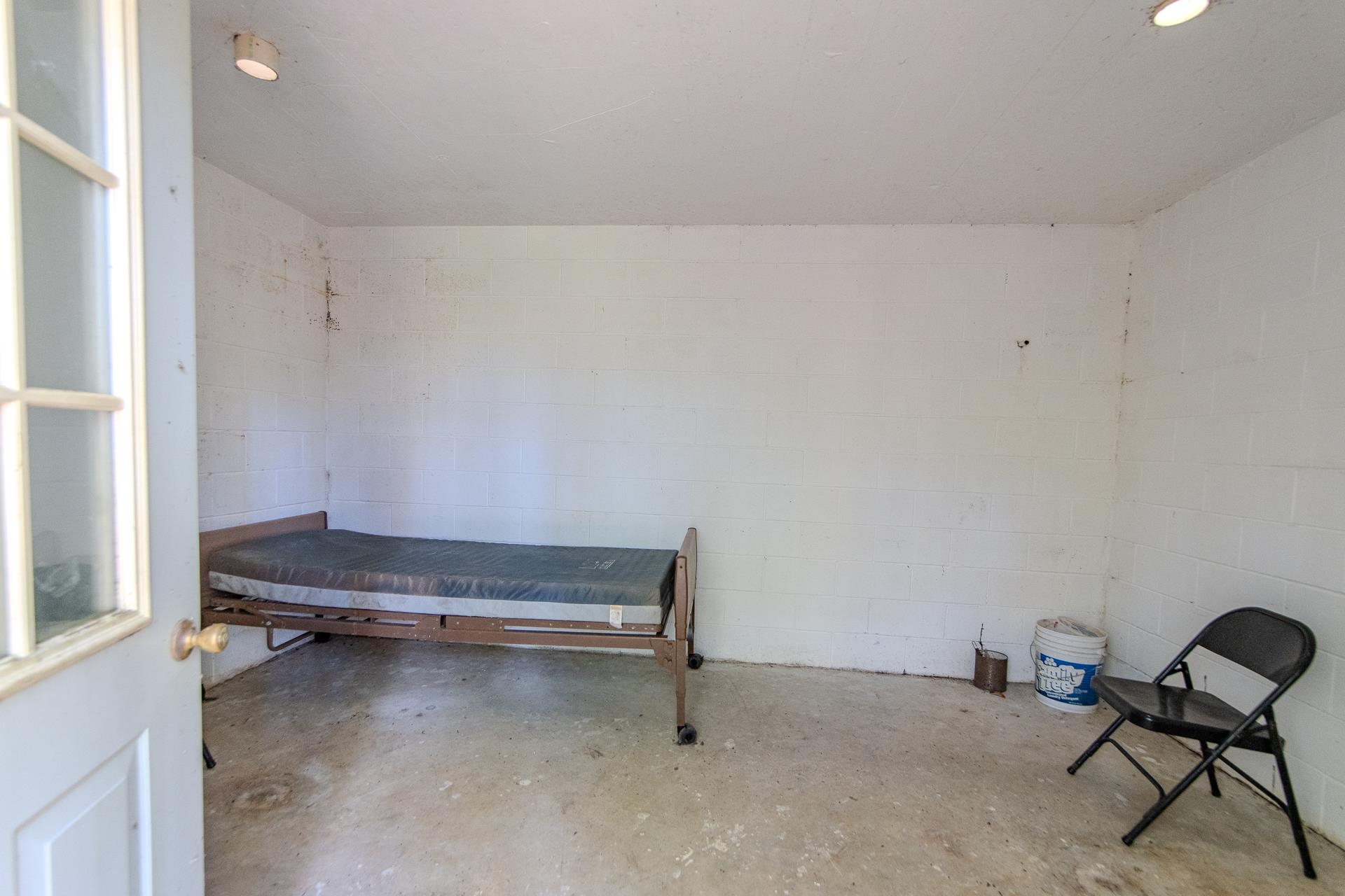 4485 Holland Creek Road Savannah, TN 38372 - Photo 36 of 39 a room with a chair and painted walls