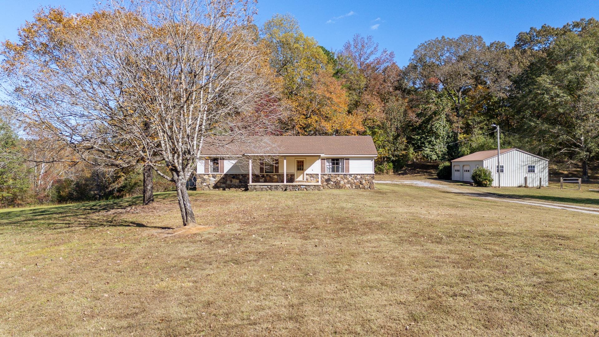 4485 Holland Creek Road Savannah, TN 38372 - Photo 10 of 39 a front view of a house with a yard and garage