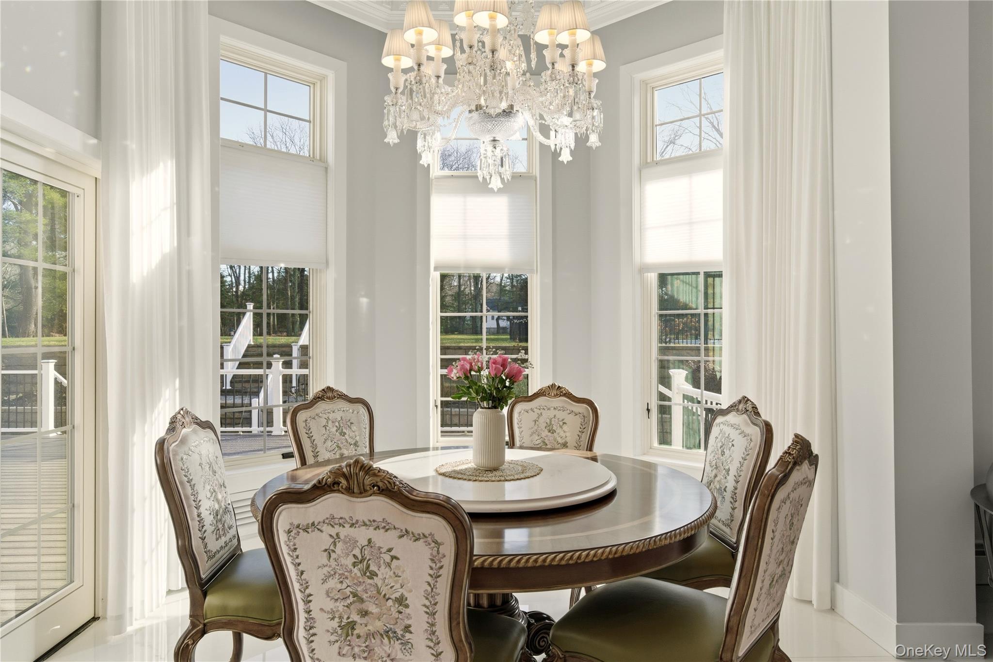 265 Laurel Lane Syosset, NY 11791 - Photo 18 of 48 a view of a dining room with furniture window and outside view