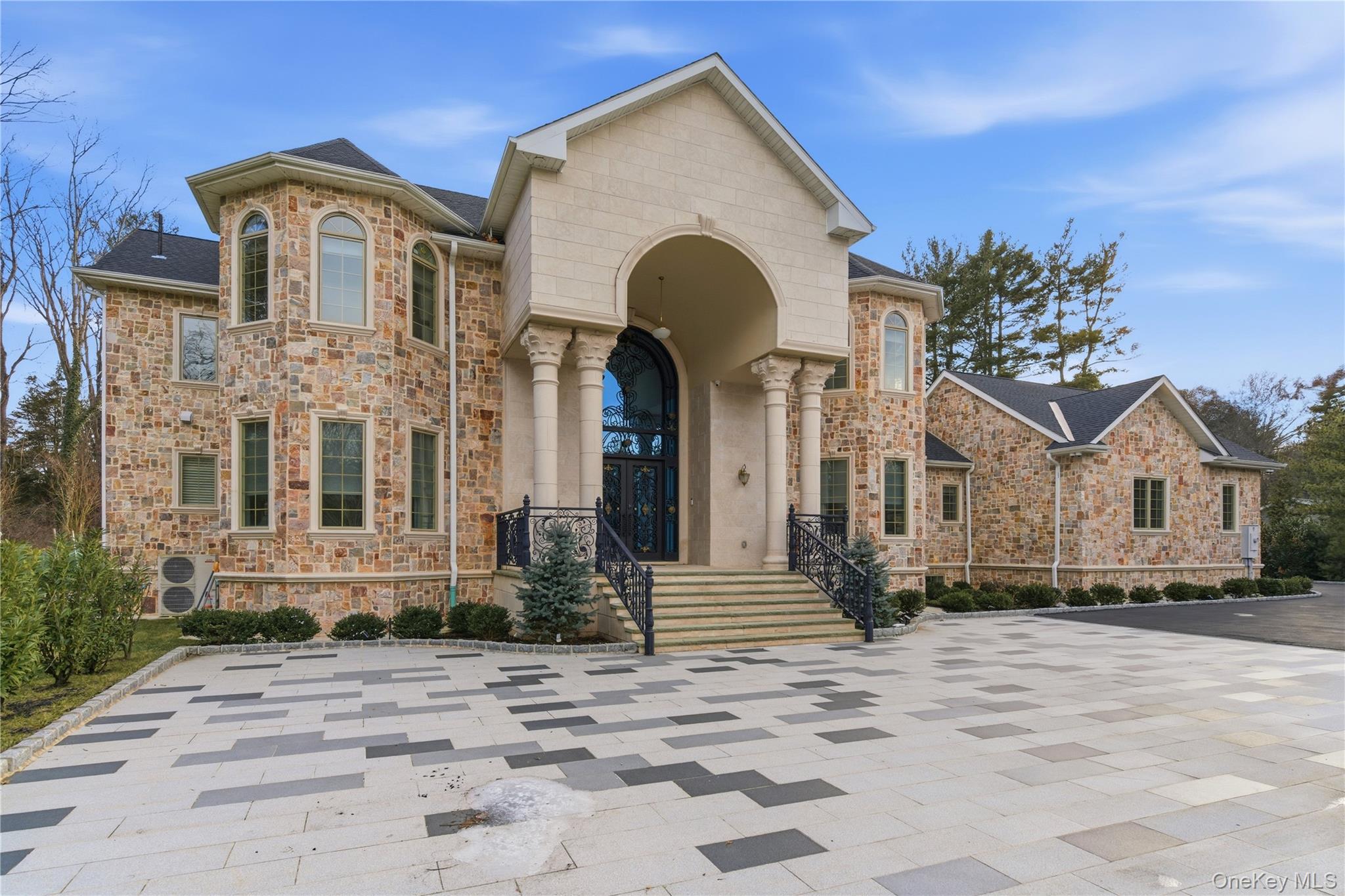 265 Laurel Lane Syosset, NY 11791 - Photo 2 of 48 a front view of a house with a yard