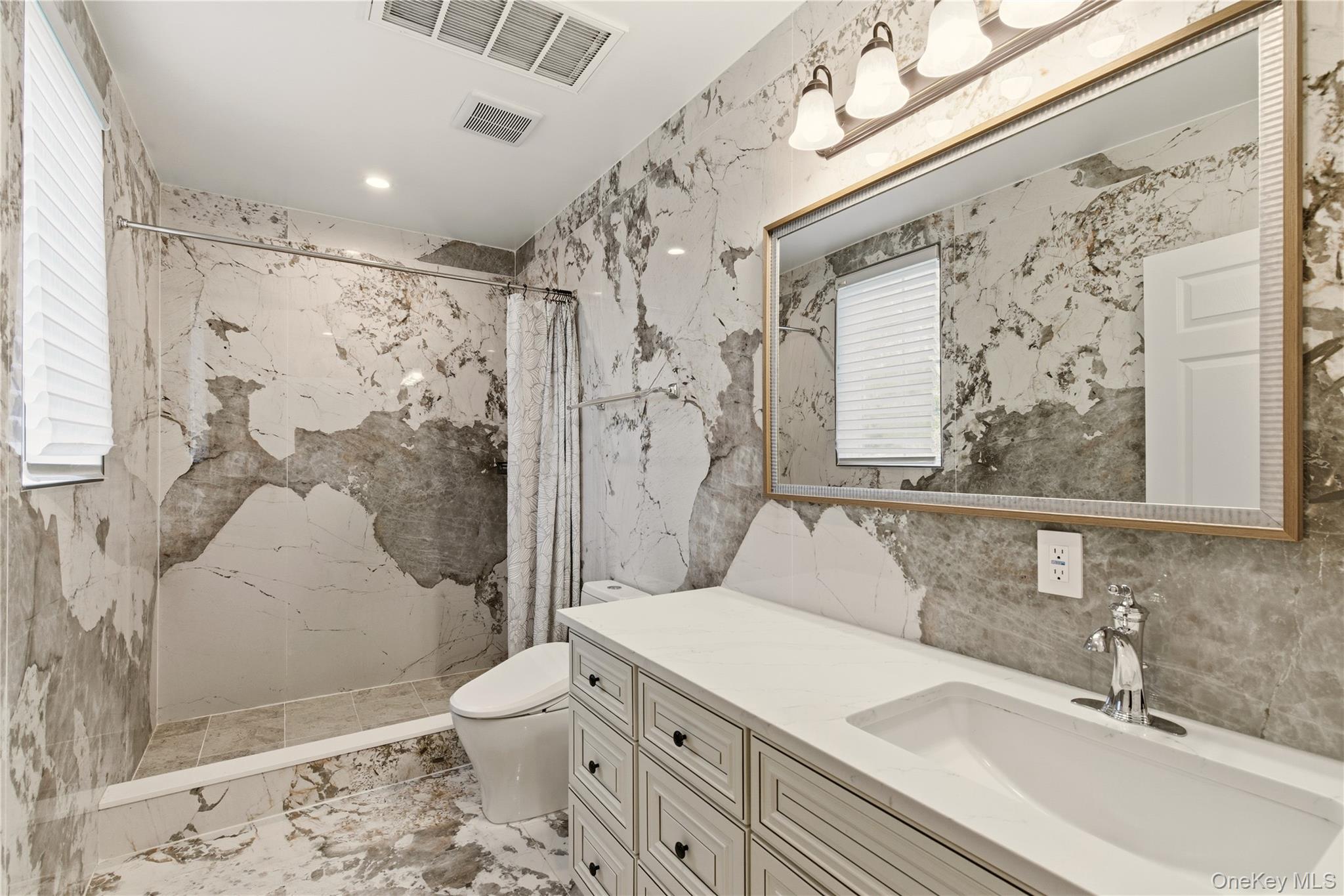 265 Laurel Lane Syosset, NY 11791 - Photo 21 of 48 a bathroom with a sink toilet tub and shower