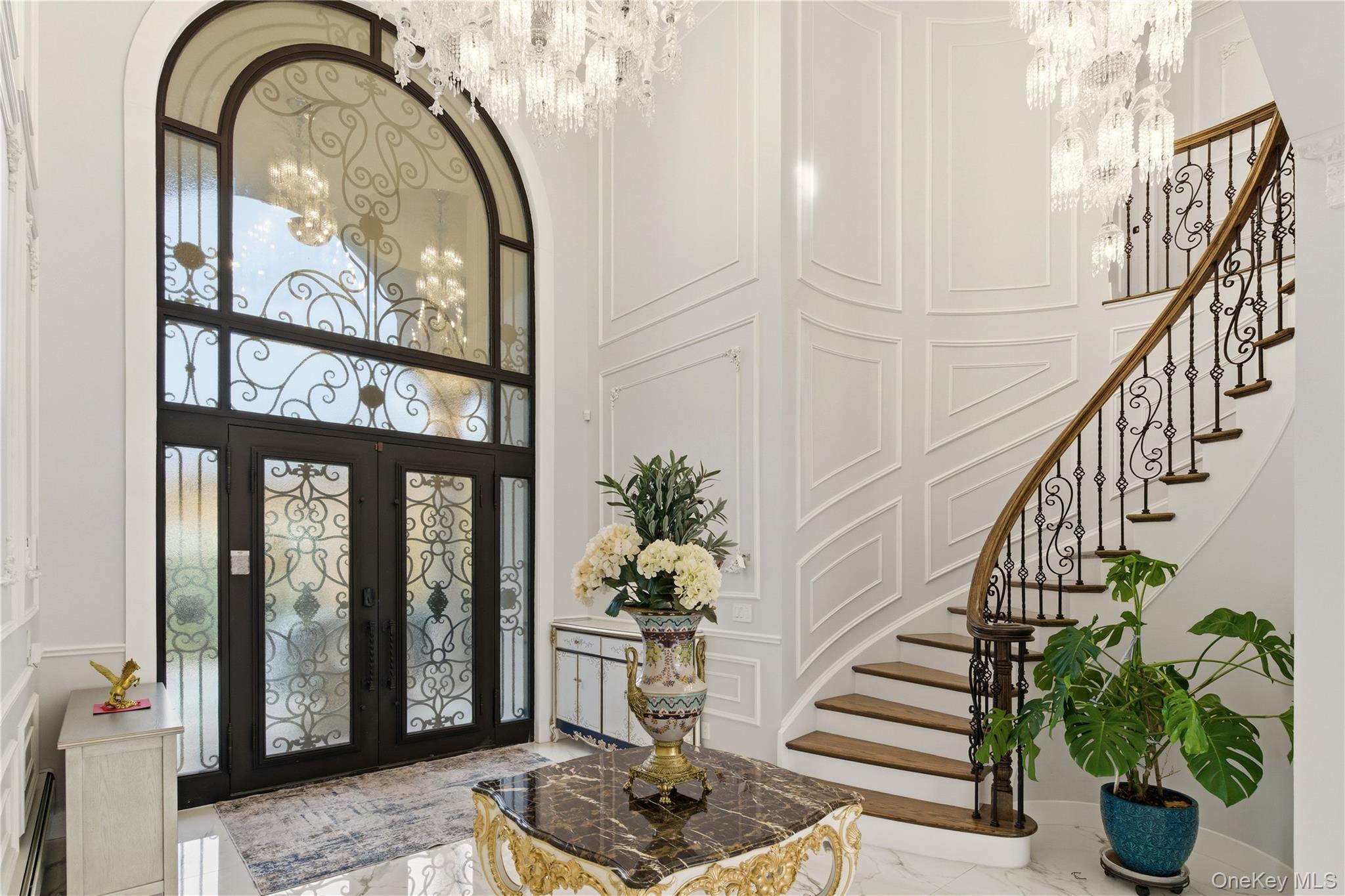 265 Laurel Lane Syosset, NY 11791 - Photo 26 of 48 a vase of flowers sitting on a floor in front of a house