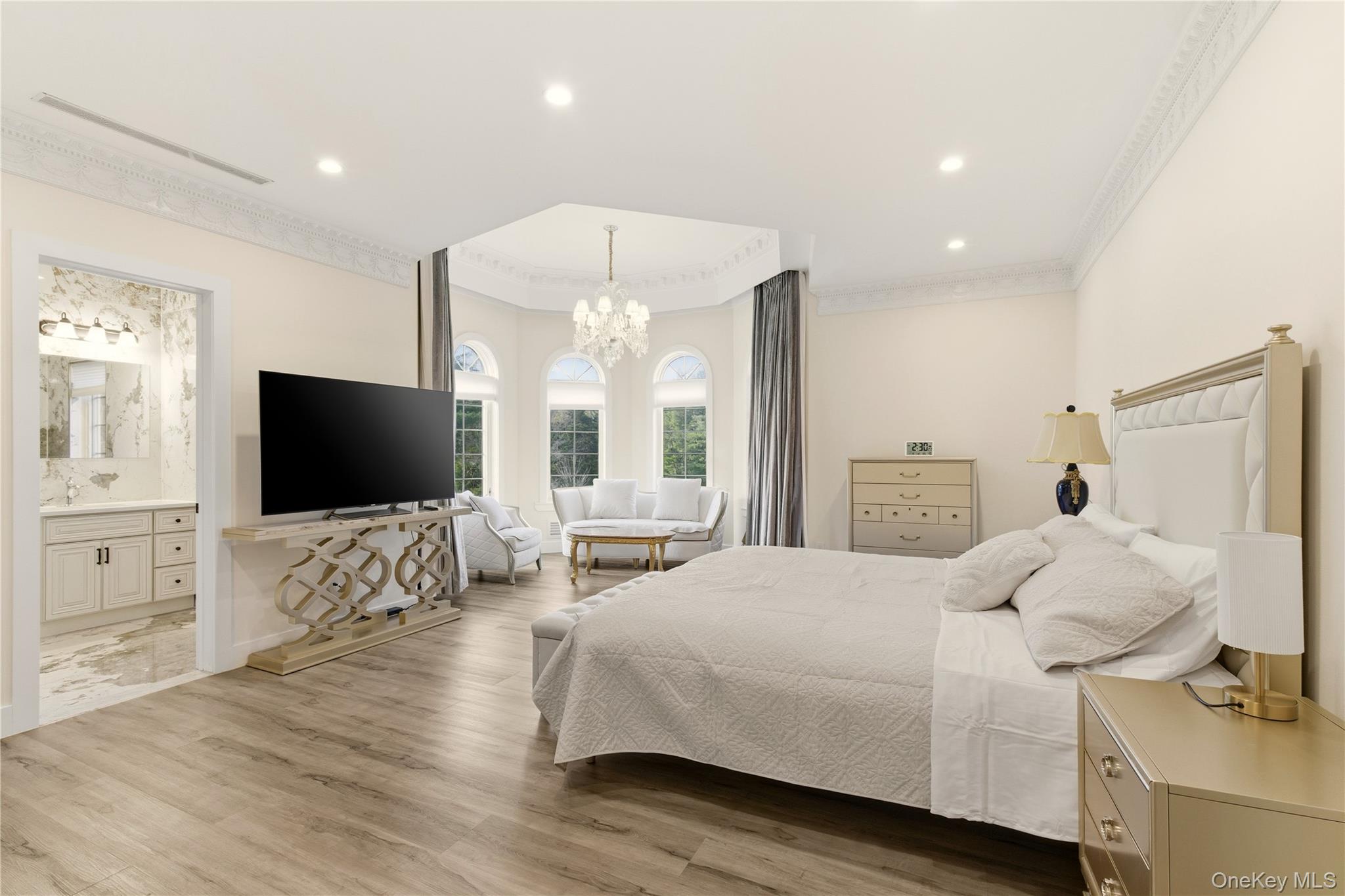 265 Laurel Lane Syosset, NY 11791 - Photo 28 of 48 a bedroom with a bed and a flat screen tv