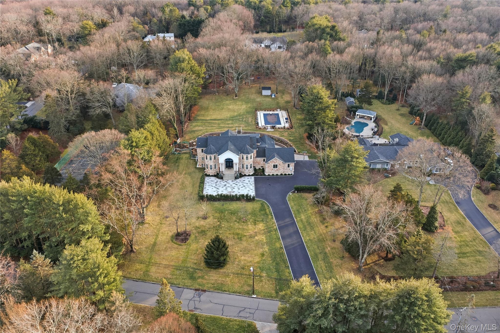 265 Laurel Lane Syosset, NY 11791 - Photo 4 of 48 an aerial view of a house with a yard