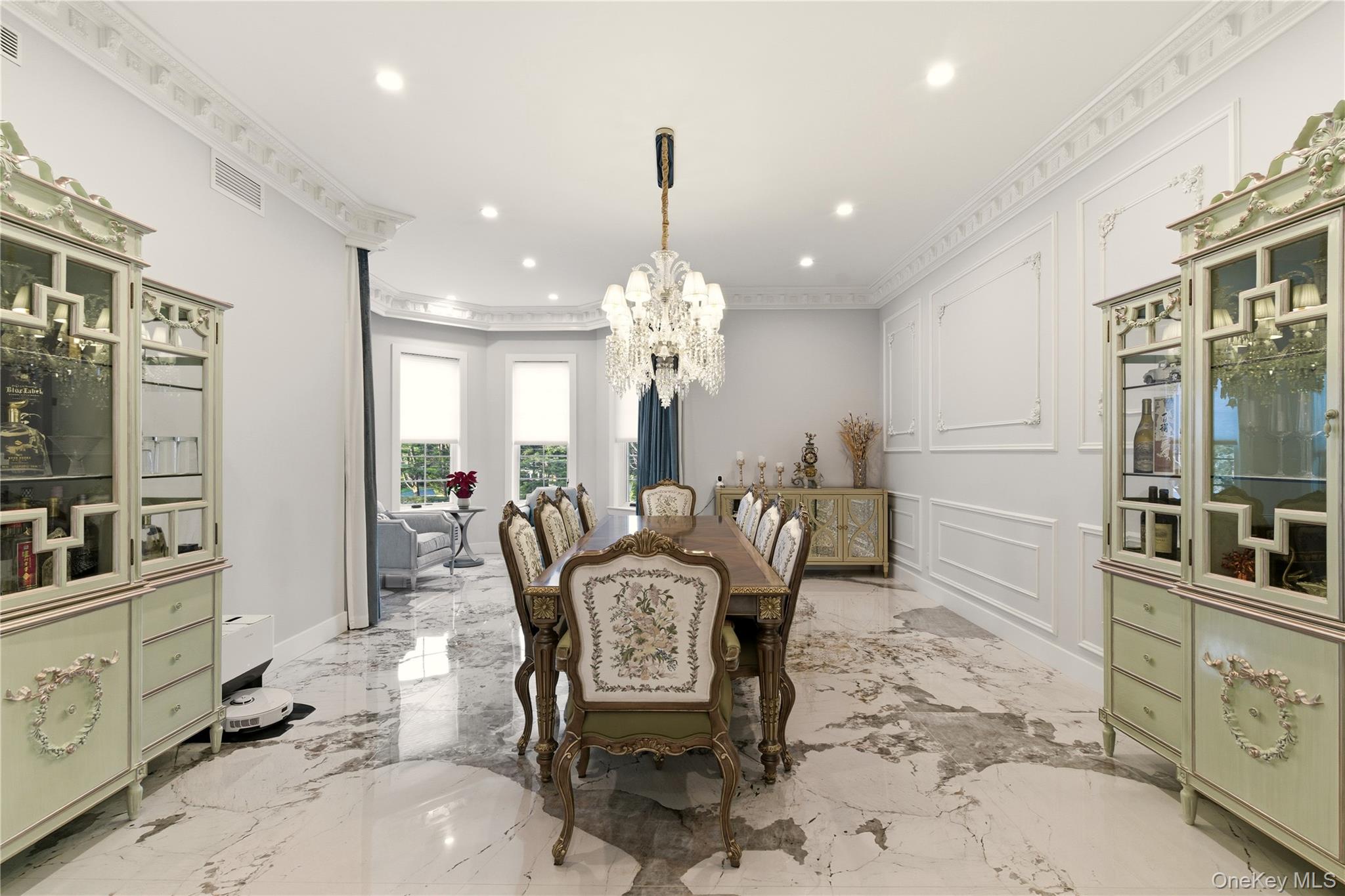 265 Laurel Lane Syosset, NY 11791 - Photo 9 of 48 a dining room with furniture a chandelier and window