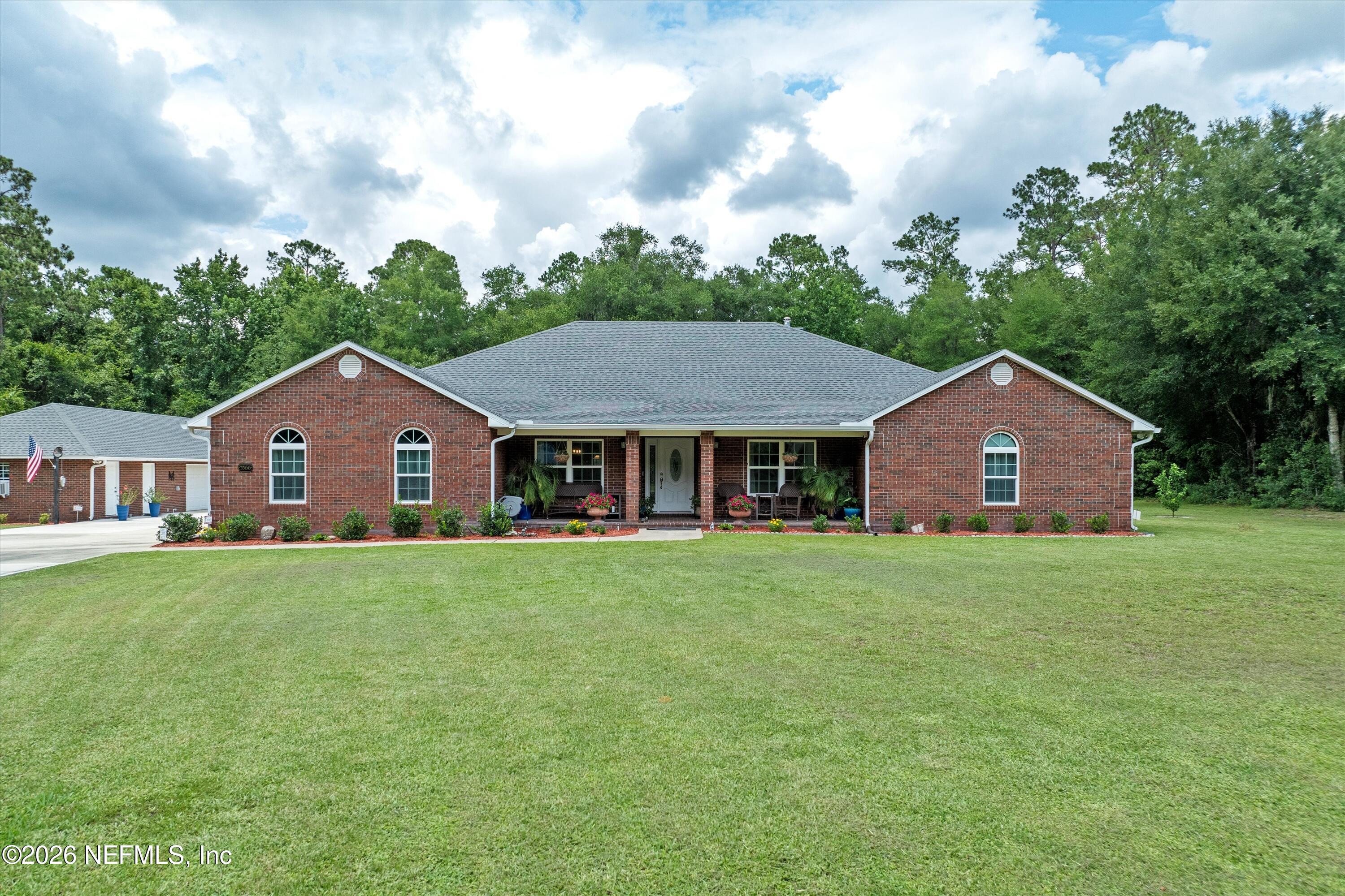 5566 Don Manuel Road Elkton, FL 32033 - Photo 4 of 47 a front view of a house with yard and green space