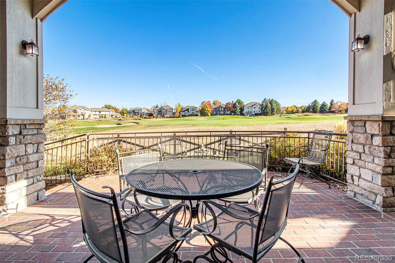 10604 Osceola Loop Westminster, CO 80031 - Photo 16 of 32 a view of a chairs and table on the terrace