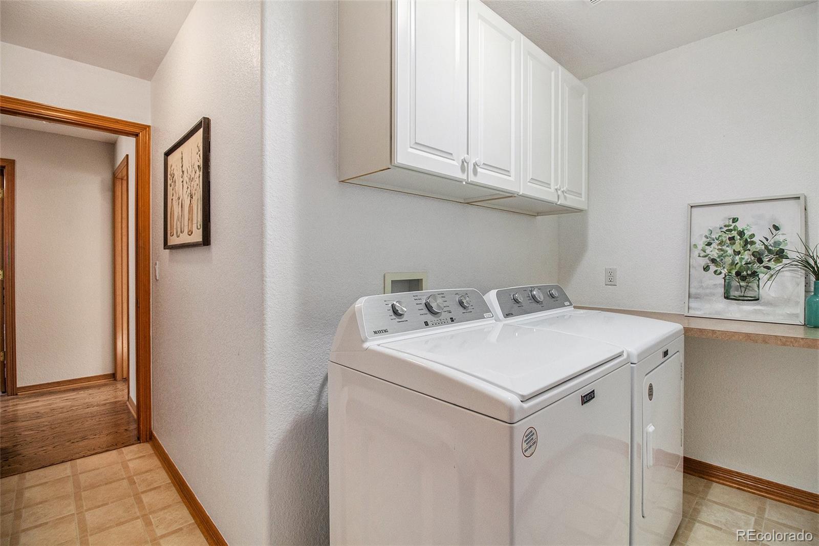 10604 Osceola Loop Westminster, CO 80031 - Photo 28 of 32 a utility room with dryer and washer