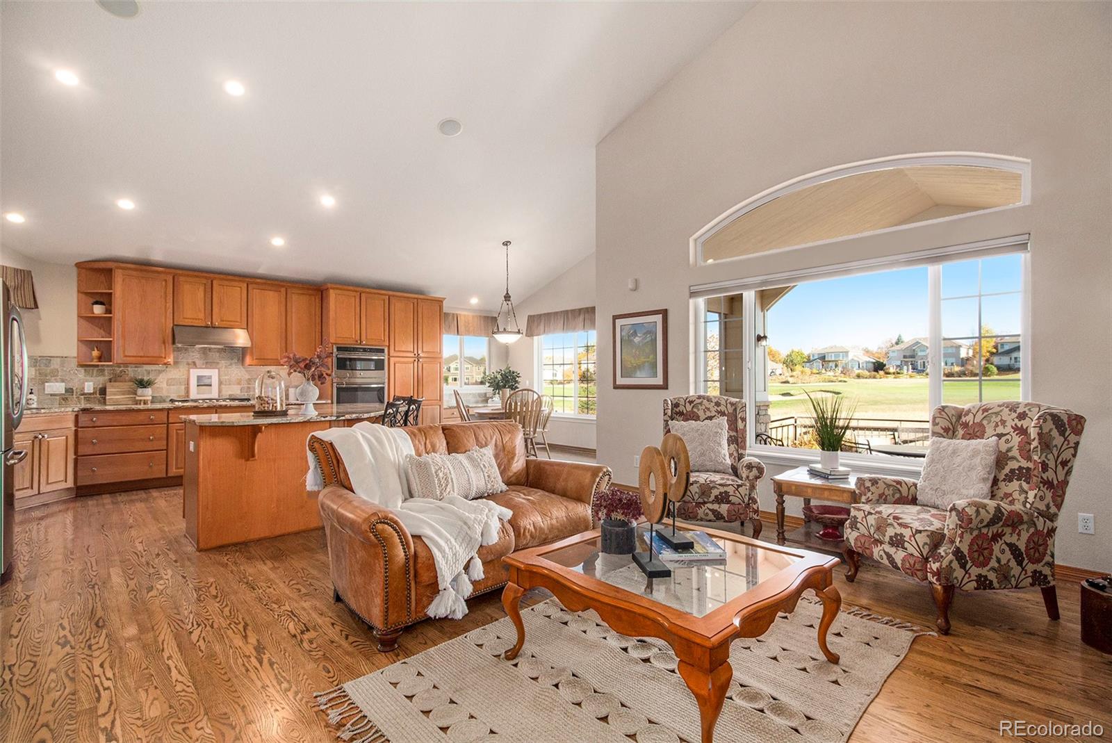 10604 Osceola Loop Westminster, CO 80031 - Photo 4 of 32 a living room with lots of furniture and kitchen view
