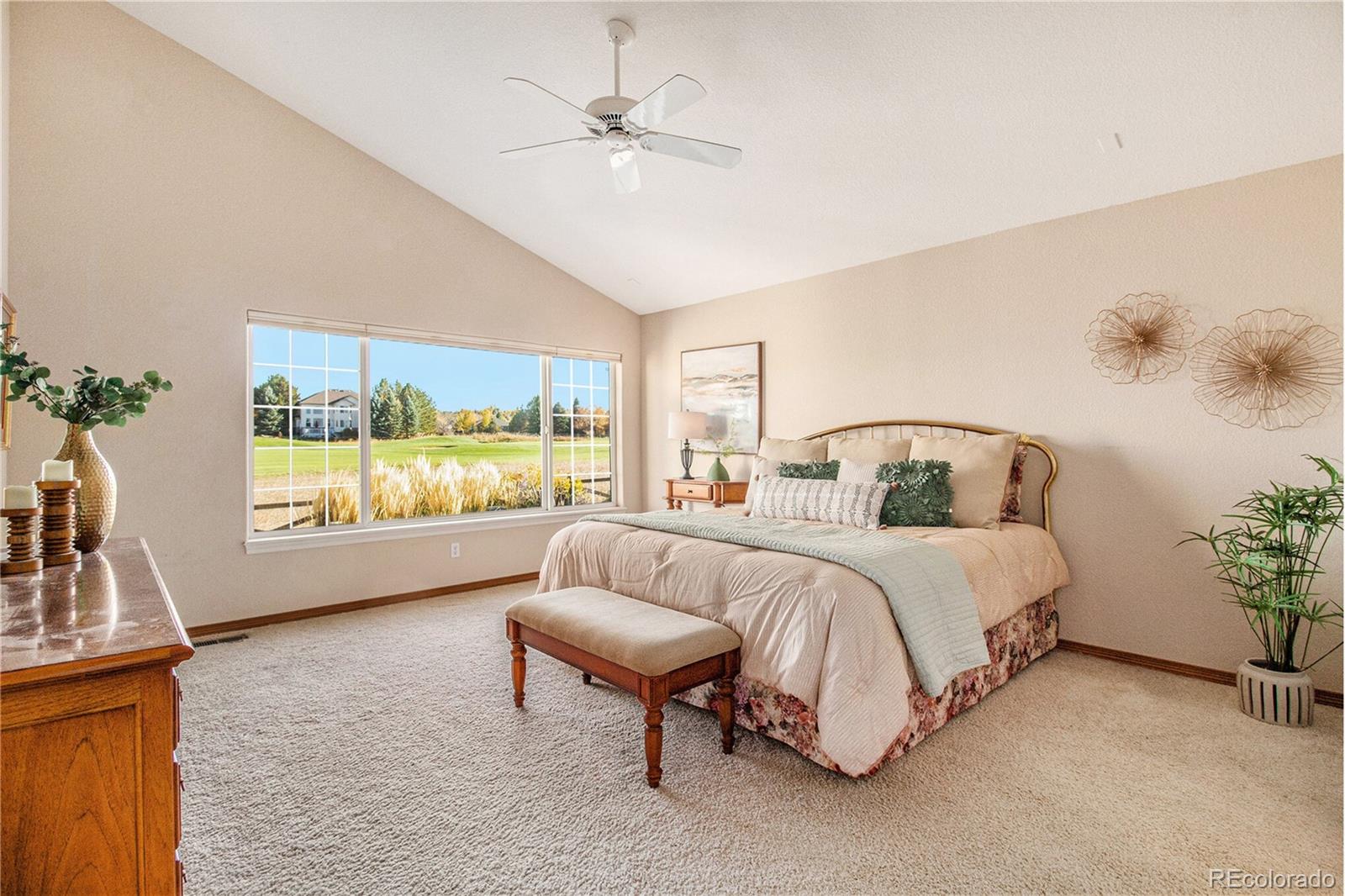 10604 Osceola Loop Westminster, CO 80031 - Photo 7 of 32 a spacious bedroom with a bed and a large window with outer view