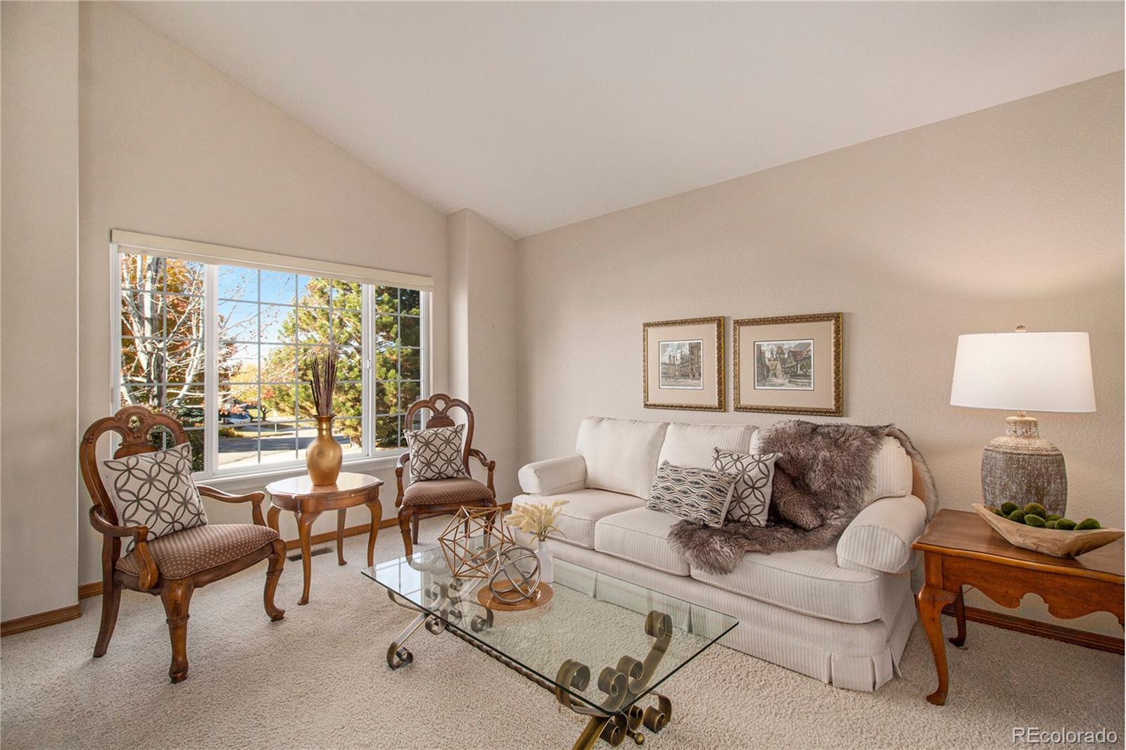 10604 Osceola Loop Westminster, CO 80031 - Photo 10 of 32 a living room with furniture and a window