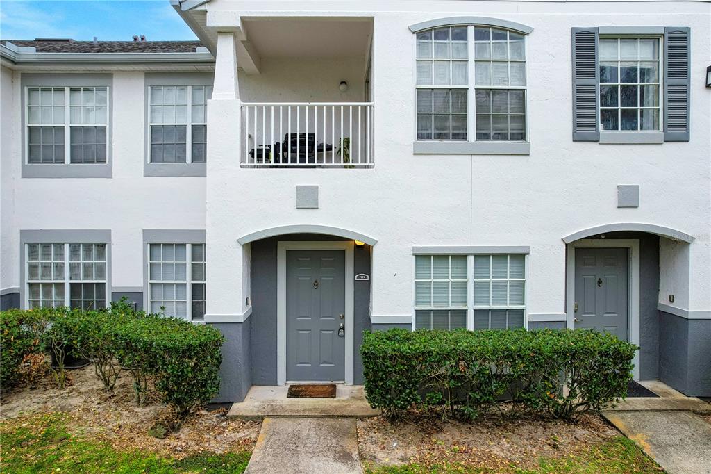 4324 South Kirkman Road, Unit 1103 Orlando, FL 32811 - Photo 1 of 20 a front view of a house with a garden