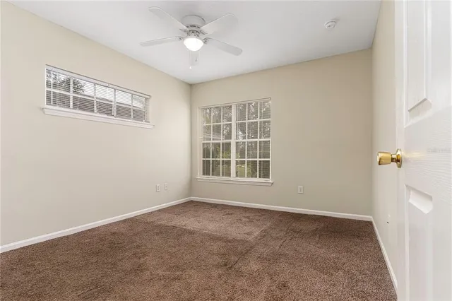 a view of empty room with windows