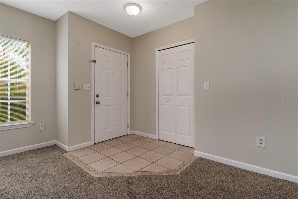 4324 South Kirkman Road, Unit 1103 Orlando, FL 32811 - Photo 4 of 20 an empty room with windows