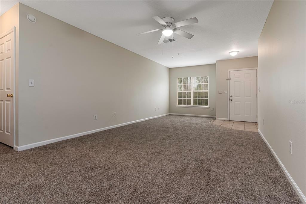4324 South Kirkman Road, Unit 1103 Orlando, FL 32811 - Photo 5 of 20 a view of an empty room with a window
