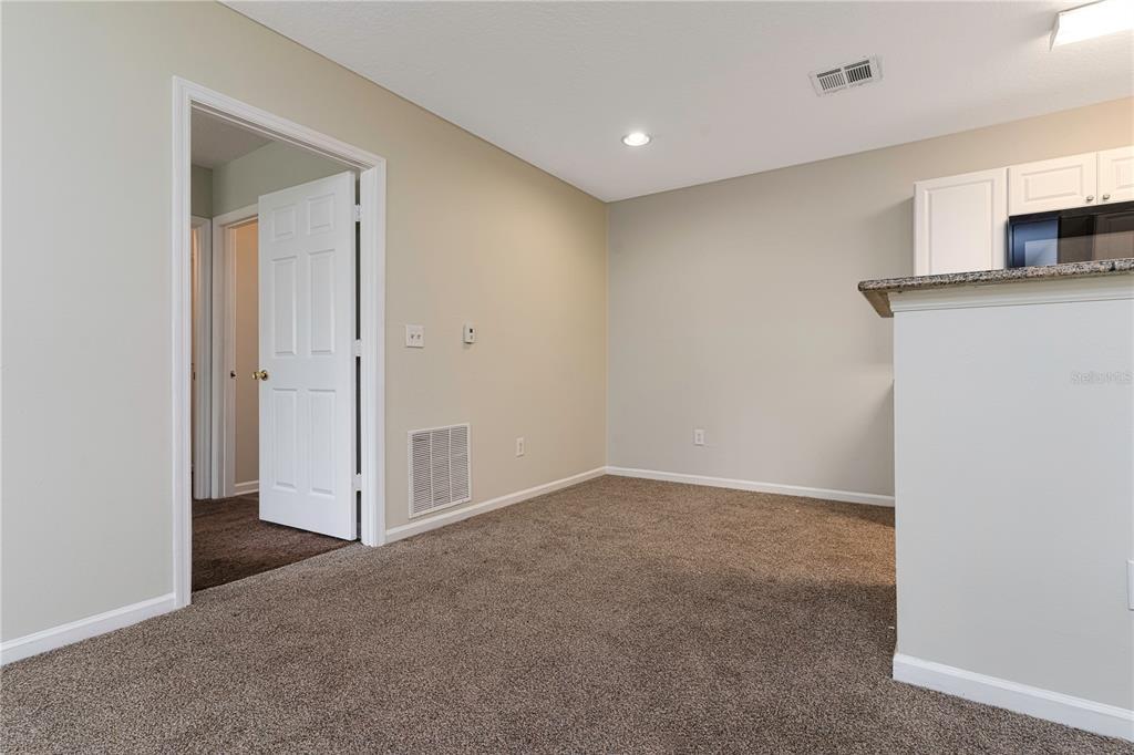 4324 South Kirkman Road, Unit 1103 Orlando, FL 32811 - Photo 10 of 20 a view of a kitchen with a sink and a refrigerator