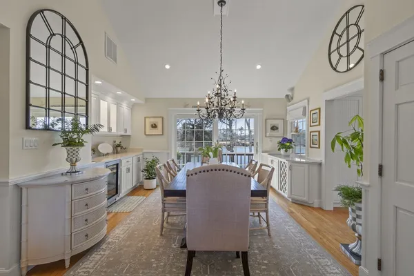 a kitchen with white cabinets and a stove