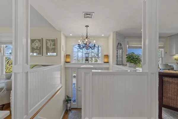 a living room with furniture a table and a fireplace