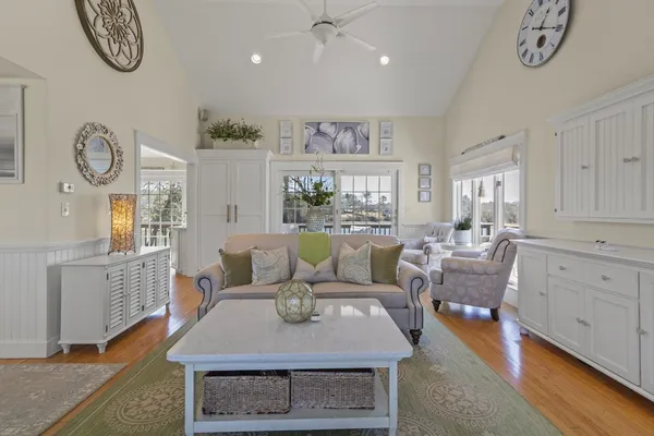a living room with furniture a table and a fireplace