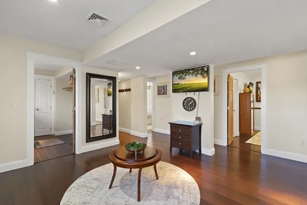 a bathroom with a toilet a sink and a window