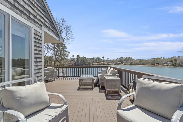 a terrace with outdoor seating and city view