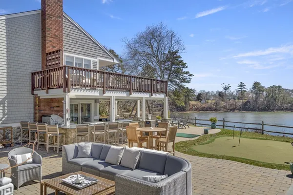 a view of a patio with couches table and chairs