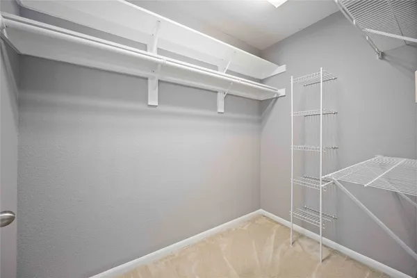 a view of an empty walk in closet