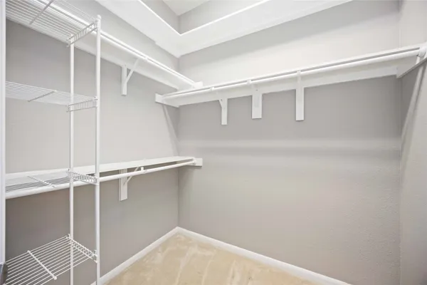 a view of an empty walk in closet