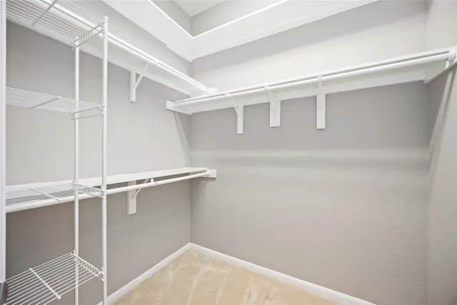 a view of an empty walk in closet