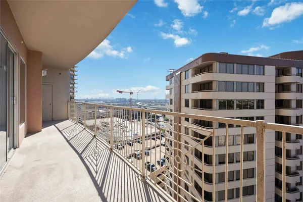 a view of a balcony with city view