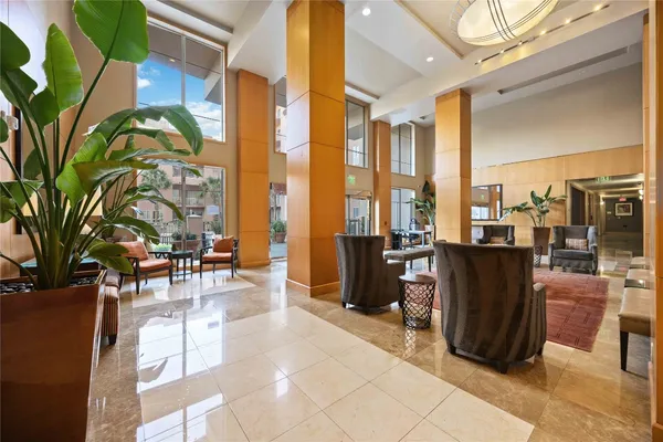 a view of balcony with chairs and potted plants
