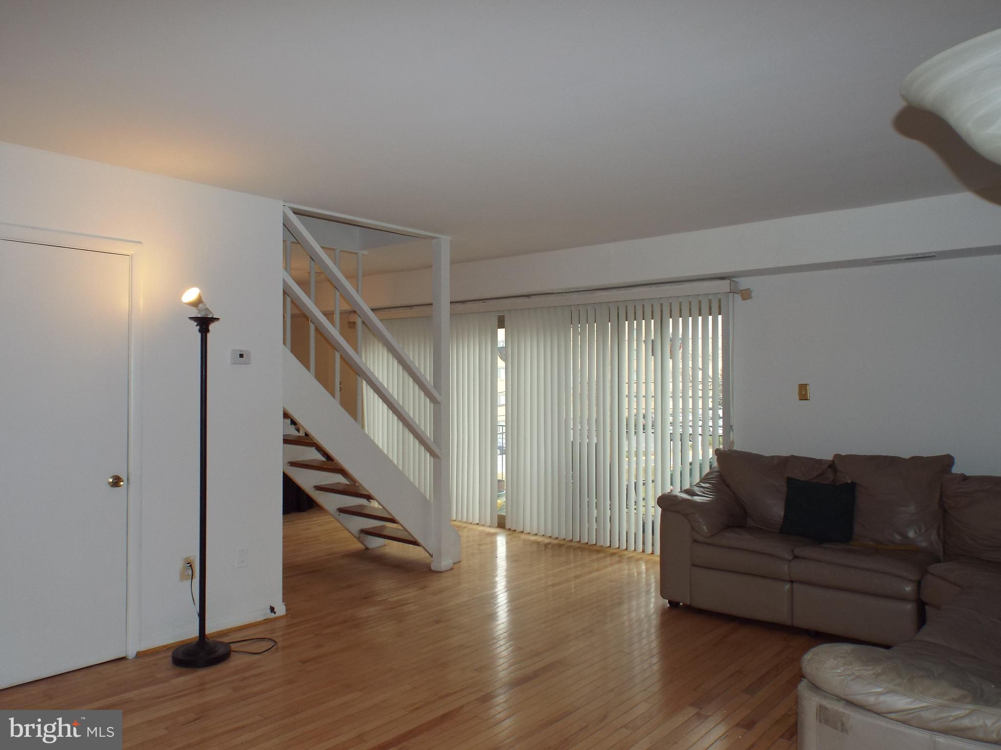 8616 Manchester Road, Unit 5 Silver Spring, MD 20901 - Photo 4 of 16 a living room with furniture and a hard wood floor