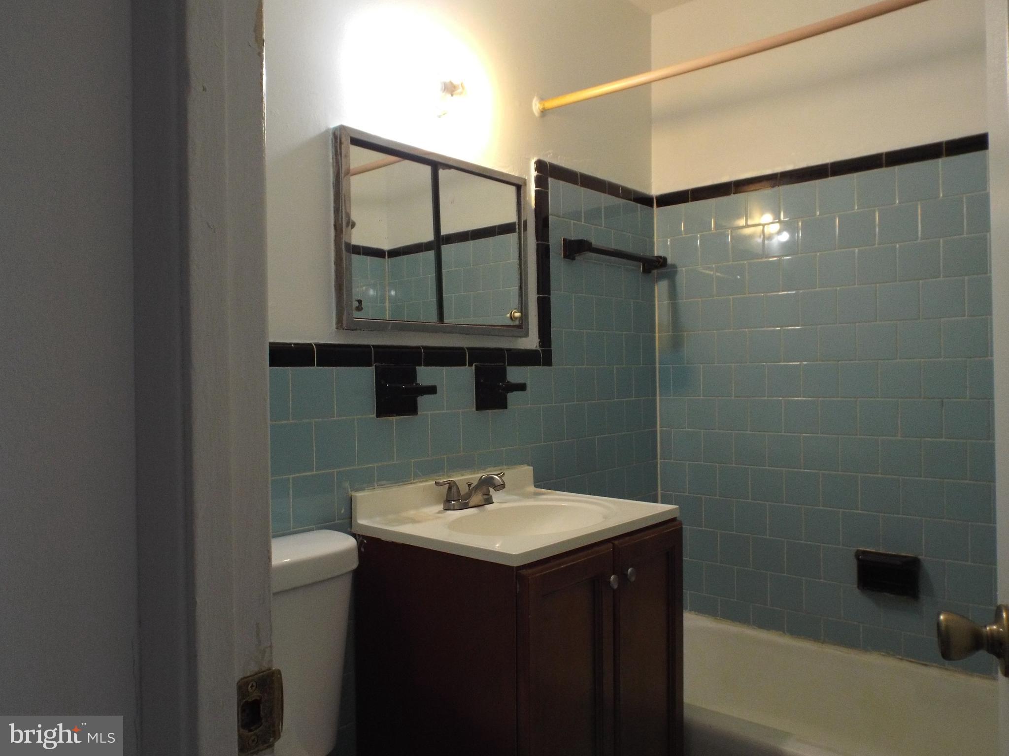 8616 Manchester Road, Unit 5 Silver Spring, MD 20901 - Photo 9 of 16 a bathroom with a sink and a mirror