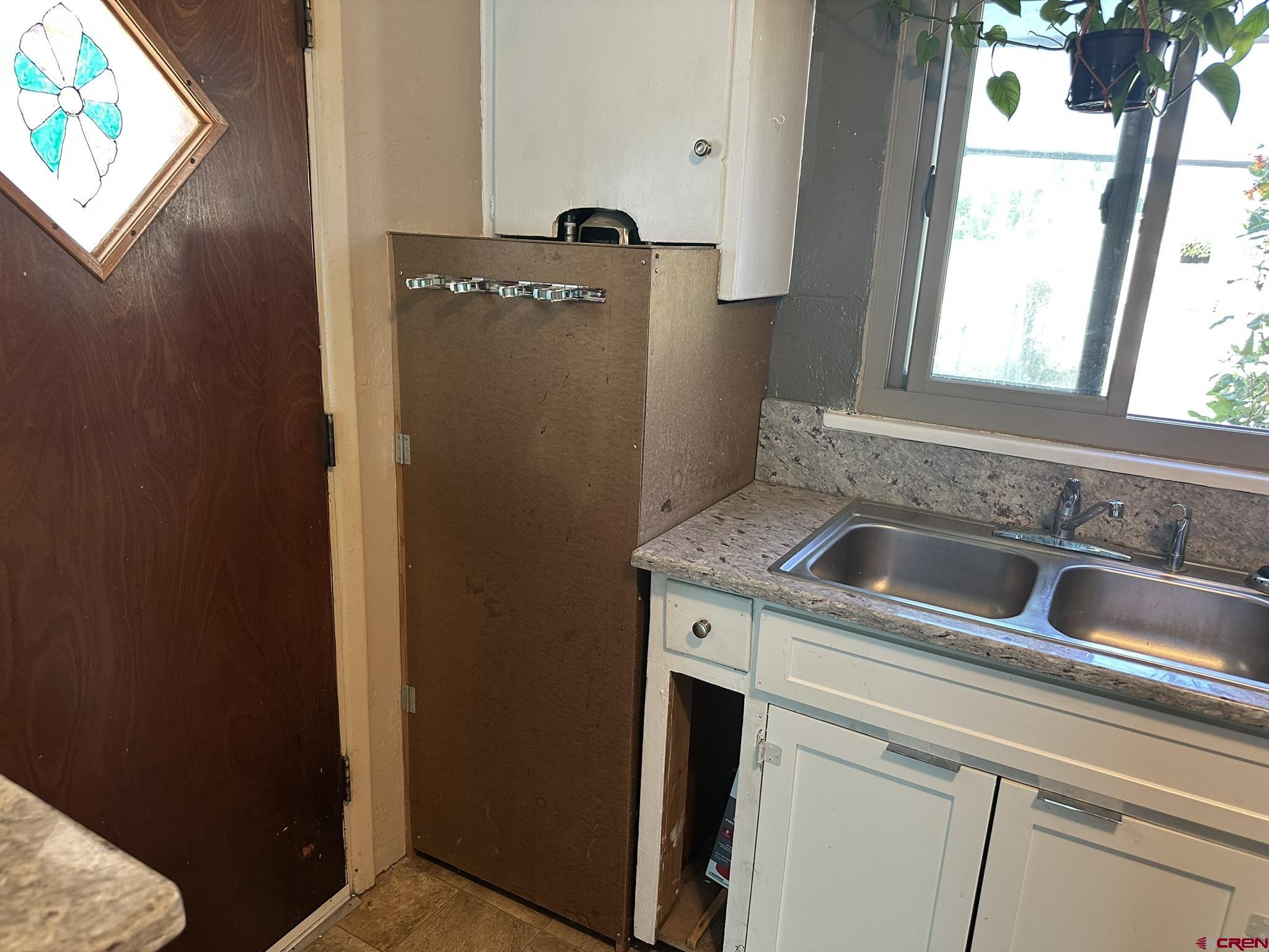 435 South Elm Street Cortez, CO 81321 - Photo 14 of 17 a close view of a sink and dishwasher next to a window