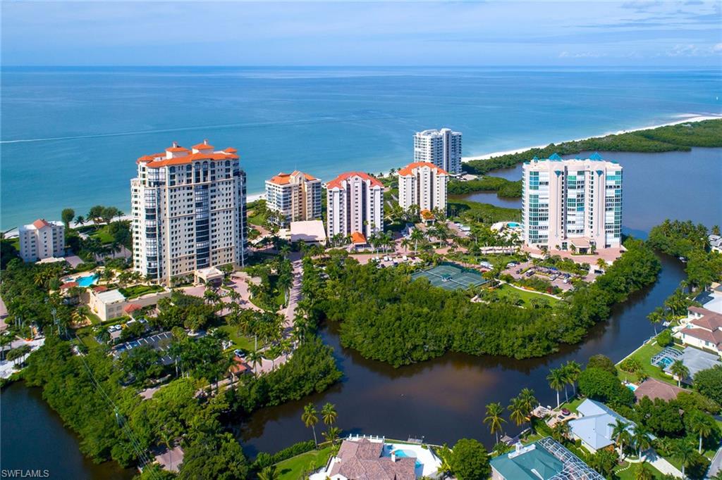 50 Seagate Drive, Unit 402B Naples, FL 34103 - Photo 21 of 26 a city view with tall buildings