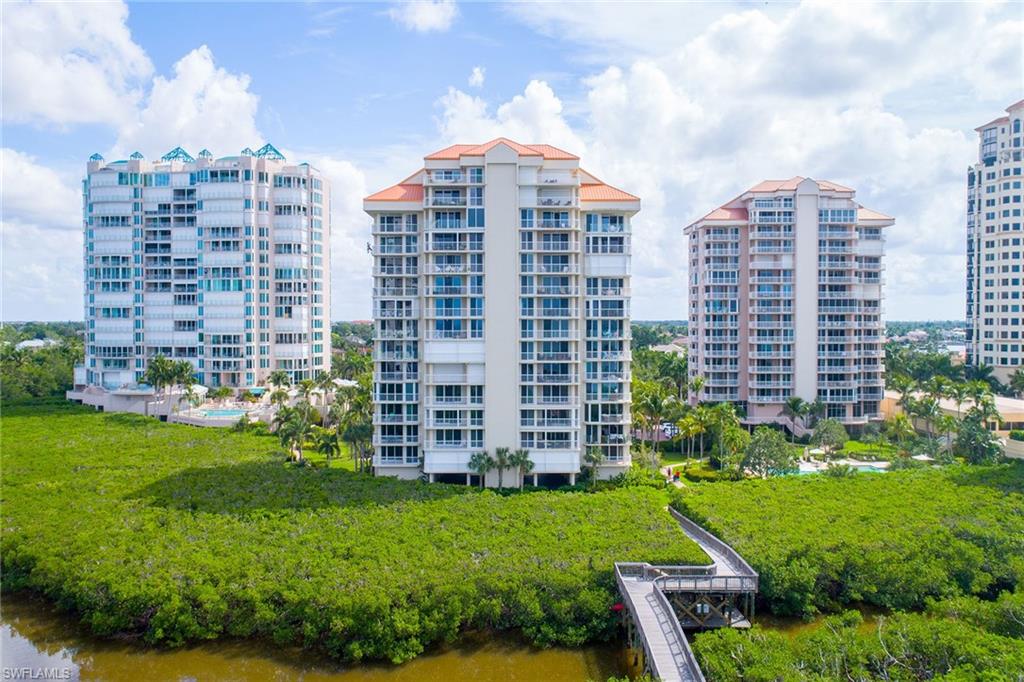 50 Seagate Drive, Unit 402B Naples, FL 34103 - Photo 25 of 26 a view of a city with tall buildings