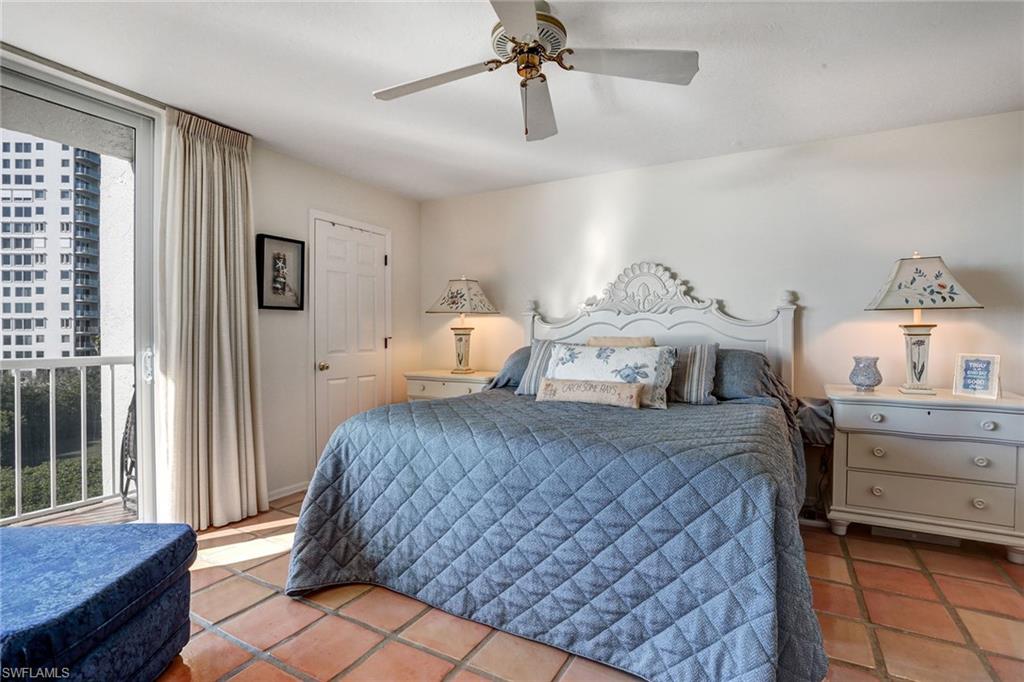 50 Seagate Drive, Unit 402B Naples, FL 34103 - Photo 10 of 26 a bedroom with bed and window