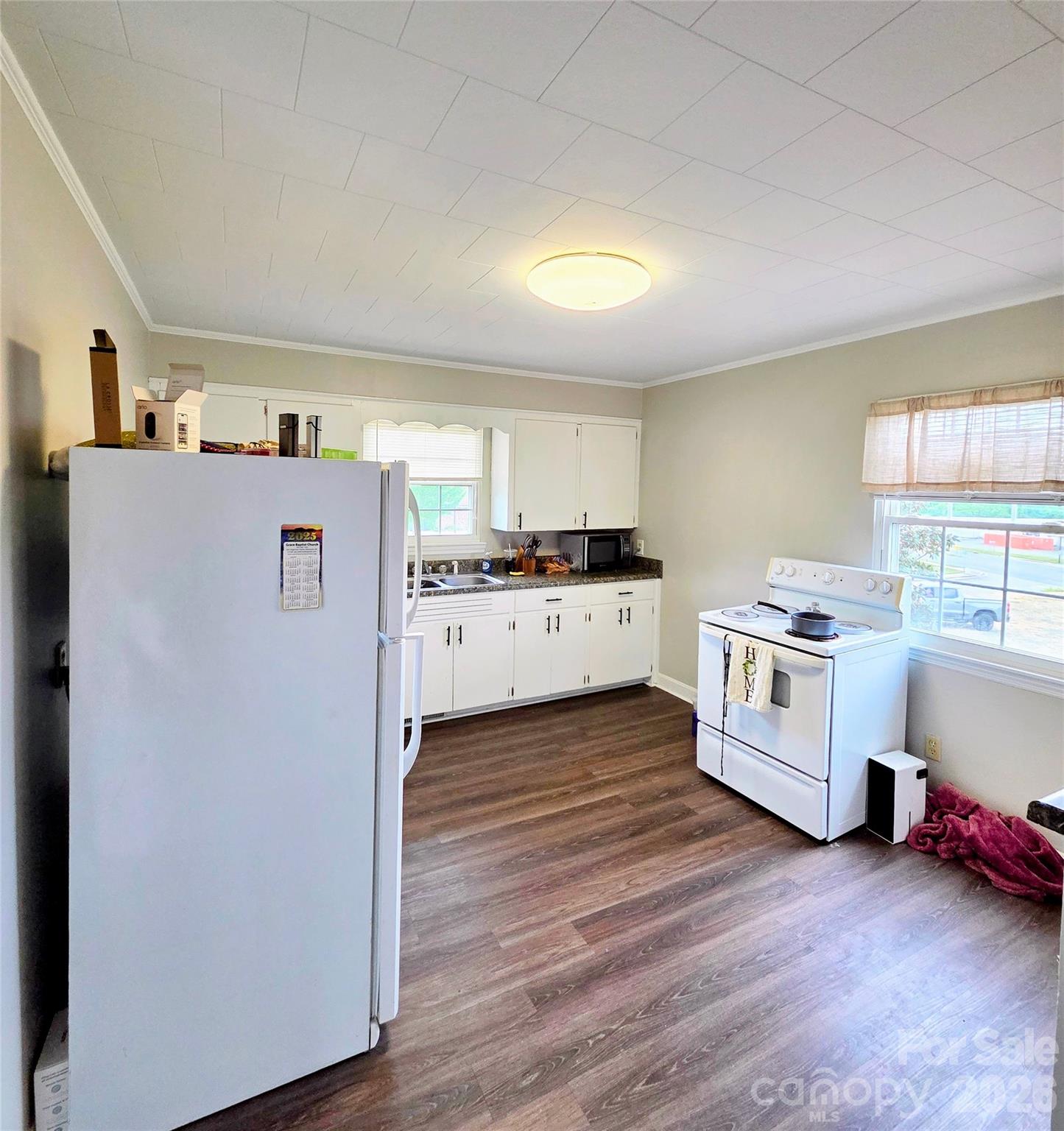 613 Judy Street Albemarle, NC 28001 - Photo 6 of 15 a kitchen with stainless steel appliances a white stove top oven and a refrigerator