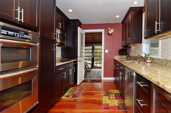 32 Pickman Road Salem, MA 01970 - Photo 11 of 26 a kitchen with stainless steel appliances granite countertop a stove a sink and a microwave