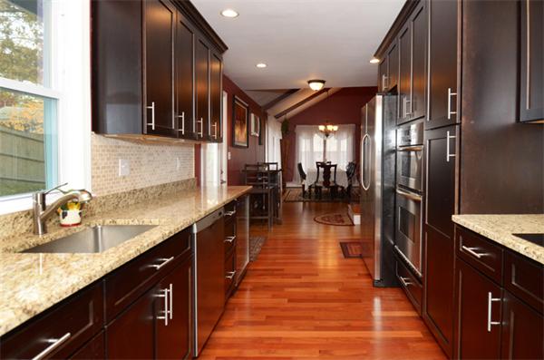 32 Pickman Road Salem, MA 01970 - Photo 15 of 26 a kitchen with stainless steel appliances granite countertop a sink and a refrigerator