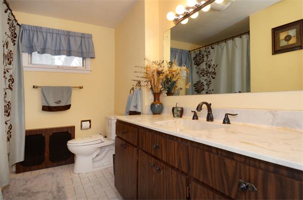 32 Pickman Road Salem, MA 01970 - Photo 23 of 26 a bathroom with a double vanity sink toilet and a mirror