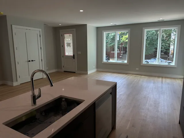 a kitchen with sink and window